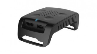 The tranmission module of the TPCAST accessory seen sporting HDMI and USB ports
